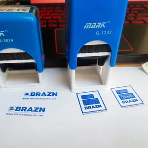 Self-inking company stamps with blue logo impressions